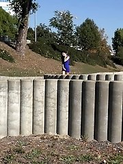 15 pictures - A babe wearing no panties pisses in public