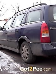 15 pictures - Violette pisses in between two parked cars