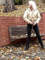15 pictures - Blonde babe squats to piss on fallen leaves