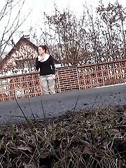 15 pictures - Brunette girl needs to pee while walking by a road