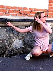 15 pictures - Gorgeous blonde is filmed peeing in public