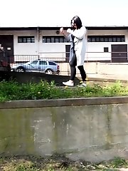 15 pictures - Dark haired girl sprinkles her piss off a ledge