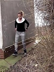 15 pictures - Brunette girl needs to pee while walking by a road
