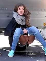 15 pictures - Sexy European squats by a trailer to piss