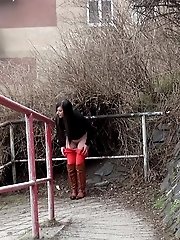 15 pictures - Black haired girl pisses on a public path