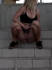 15 pictures - Cute blonde pisses in public in the city