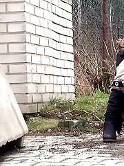 15 pictures - Redhead babe pisses in the middle of the city