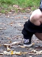 15 pictures - Blonde babe pees next to some garages