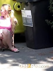 15 pictures - European babe pisses next to recycling bins