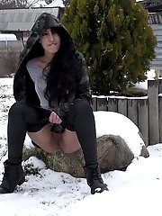 15 pictures - Stunning dark haired girl pisses out in the snow