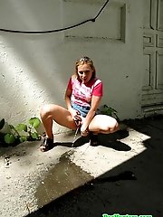 16 pictures - Nasty teen slut takes a piss in the backstreet