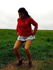 16 pictures - Girlie feeling cold takes a quick leak on a field