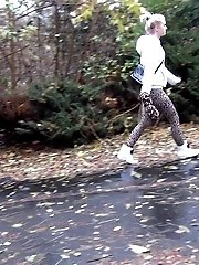 15 pictures - Pretty blonde teen pees in public near buildings