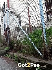 15 pictures - Blonde babe pees on the bottom of some steps