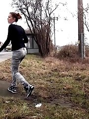 15 pictures - Brunette girl needs to pee while walking by a road