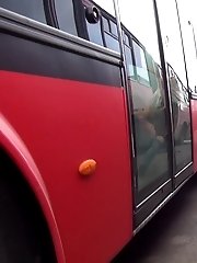 15 pictures - Sexy blonde girl pisses between parked buses