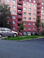15 pictures - Sexy brunette pisses in the middle of a car park