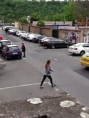 15 pictures - Hot brunette pisses in the middle of the city