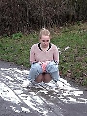 15 pictures - Cute blonde pisses onto snow to melt it