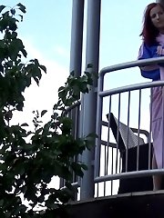 15 pictures - Pretty redhead pisses over her balcony