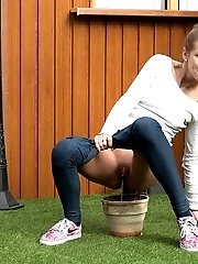15 pictures - Pretty European relieves herself in plant pot