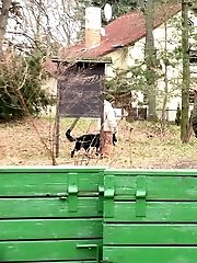 15 pictures - Pretty babe pisses onto a wooden terrace