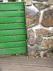 15 pictures - Pretty babe pisses onto a wooden terrace