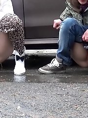 15 pictures - Two friends piss behind a parked car