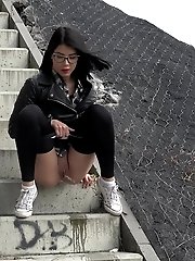 15 pictures - Pretty dark haired girl in glasses pees outside