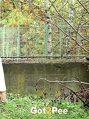 15 pictures - Exotic looking babe is desperate to piss outside