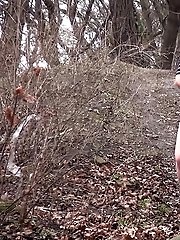 15 pictures - Dark haired babe pulls her panties while pissing