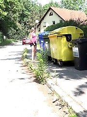 15 pictures - European babe pisses next to recycling bins