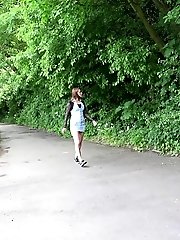 15 pictures - Redhead smokes and pisses in this scene