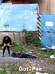 15 pictures - Dark haired girl is desperate to piss outside