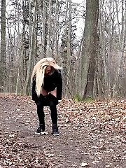 15 pictures - Blonde babe squatting to pee outside in the woods