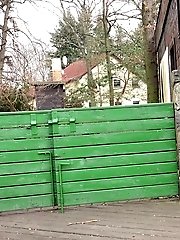 15 pictures - Pretty babe pisses onto a wooden terrace