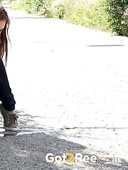 15 pictures - Cute babe rushes to beat her pee desperation