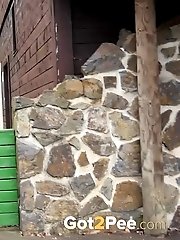 15 pictures - Pretty babe pisses onto a wooden terrace