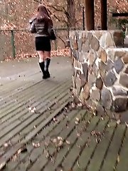 15 pictures - Gorgeous brunette in boots pisses outside