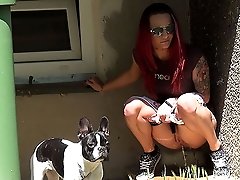 0  - Redhead pisses outside an apartment building