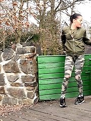 15 pictures - Pretty babe pisses onto a wooden terrace