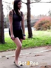 15 pictures - Gorgeous brunette pisses right next to a busy road