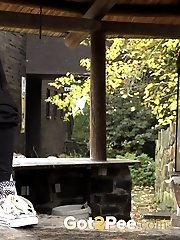 15 pictures - Counter top outdoor pissing for hot Eurobabe