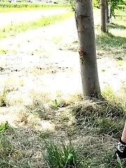 15 pictures - Blonde with plaited hair squats to piss outside