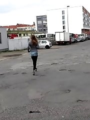15 pictures - Busty brunette pees behind a bus