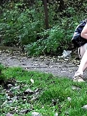 15 pictures - Hot babe pees on a public path while outside