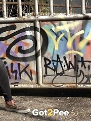 15 pictures - City pissing for stunning black haired babe