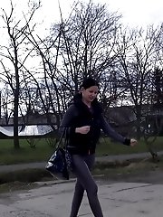 15 pictures - Dark haired girl is desperate to pee when walking