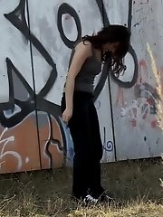 15 pictures - Pretty dark haired girl shows her ass to pee
