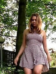 15 pictures - Pretty girl in summer dress pisses on steps